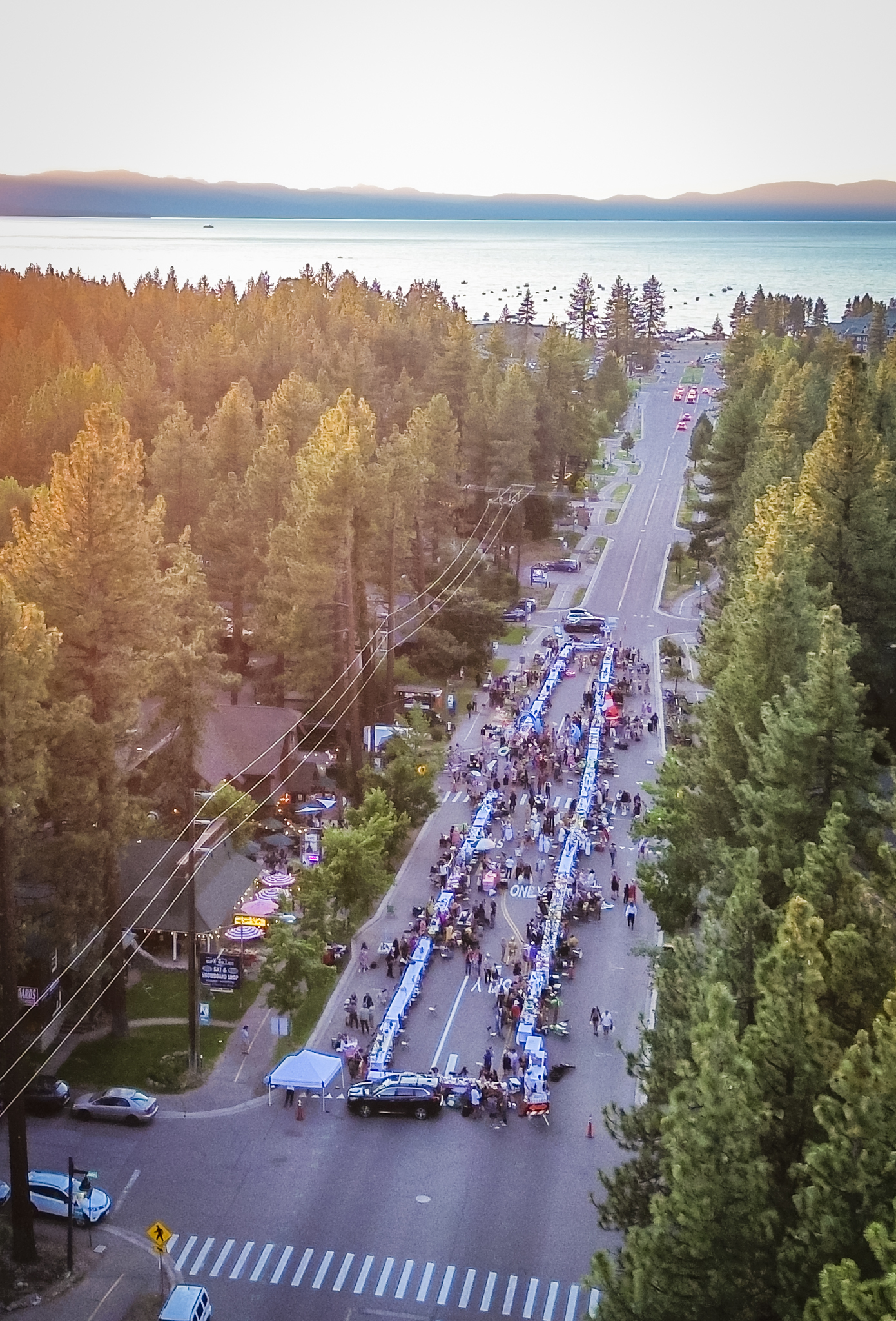 Aerial drone shot of The Longest Dinner Table stretching down the street in South Lake Tahoe